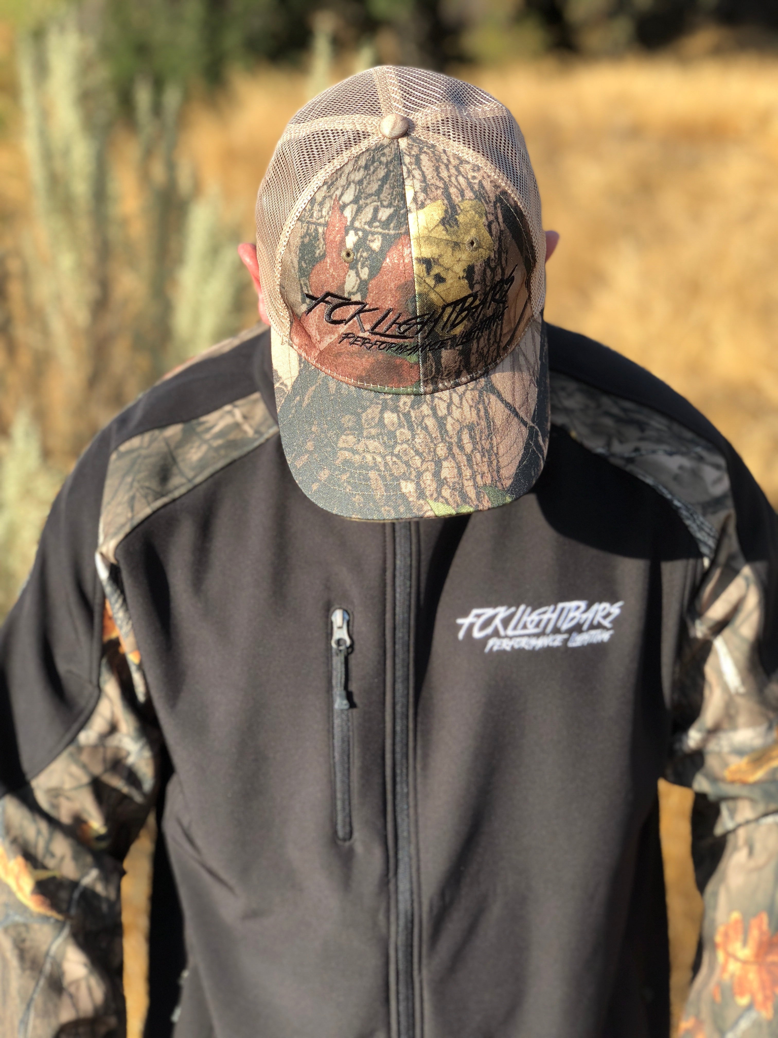 A man wearing Camo Snapback Hat (White)